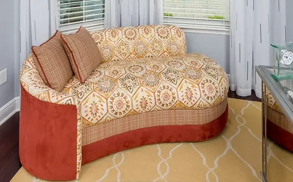 Curved window-seat settee upholstered in a geometric fabric by Custom Fabric Creations, St. Petersburg, FL